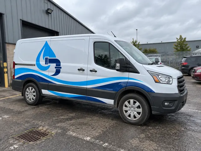 AI-generated mockup: Plumbing graphic applied to a work van
